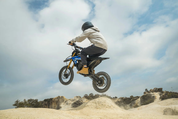 Zonveer DX1 electric dirt bike practicing brake control on a closed trail