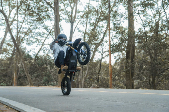Zonveer DX1 electric dirt bike on a forest practice track