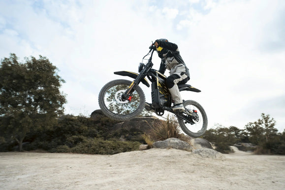 Zonveer ZX3 electric dirt bike jump landing practice on private dirt terrain
